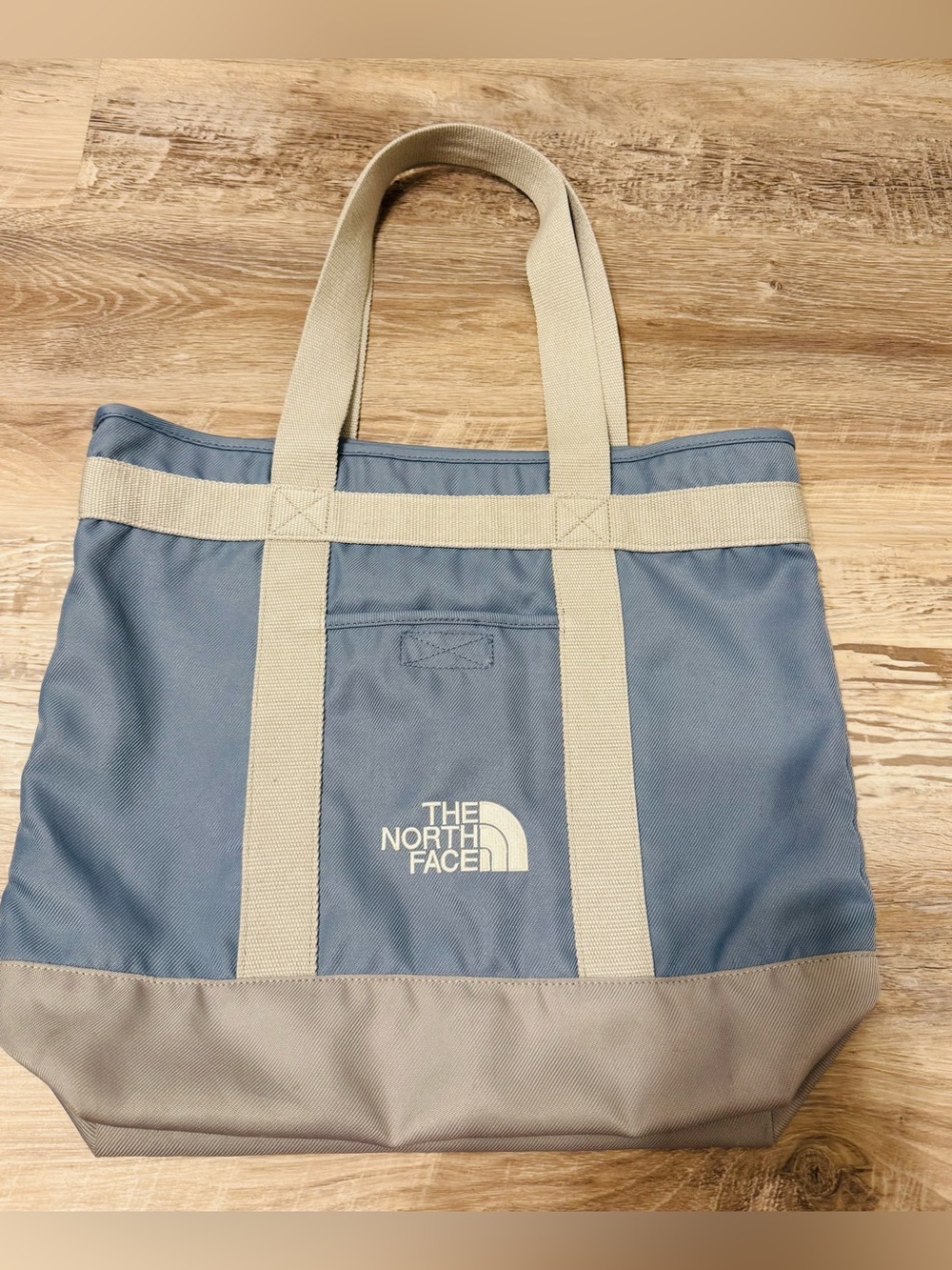 The North Face Borealis tote bag featuring sturdy fabric handles and a logo on t